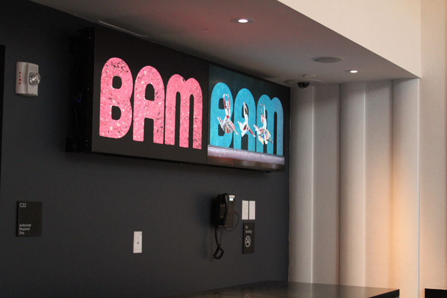 Digital displays showing colorful graphics of the word BAM