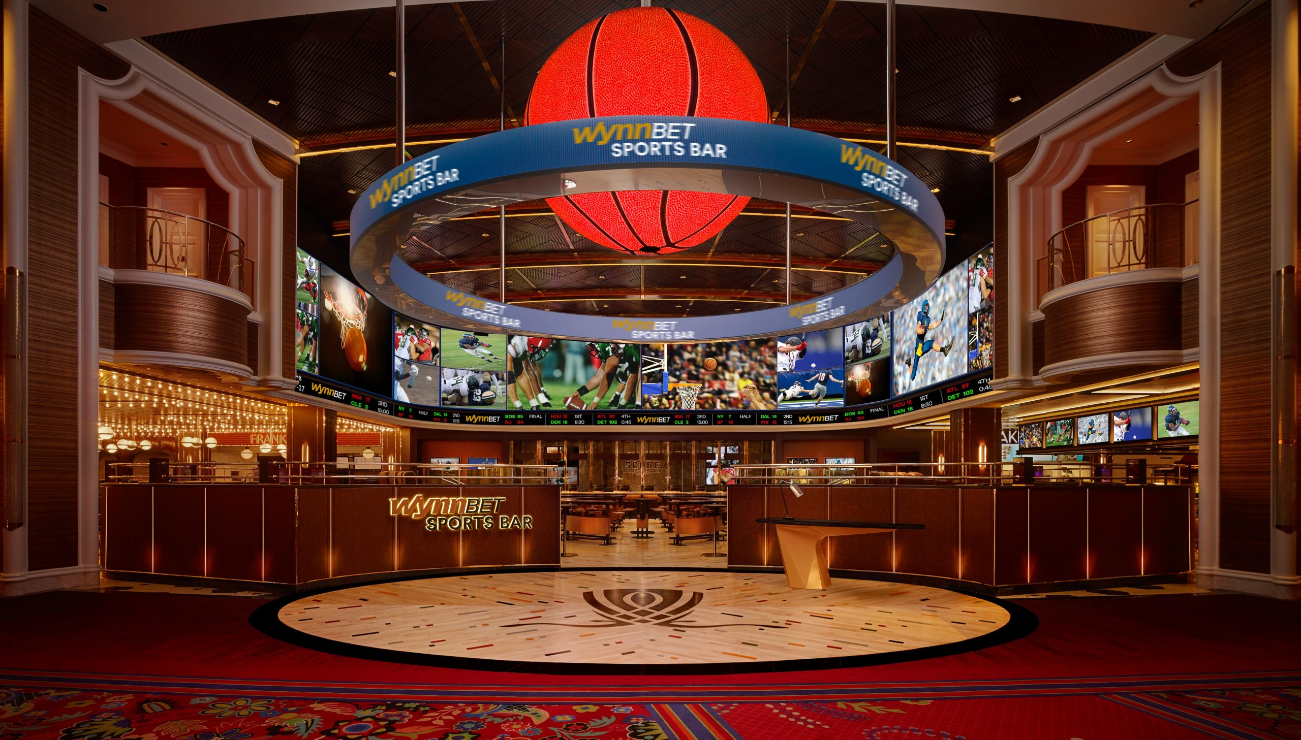 Digital displays showing various sports games & game data in the WynnBET Sports Bar