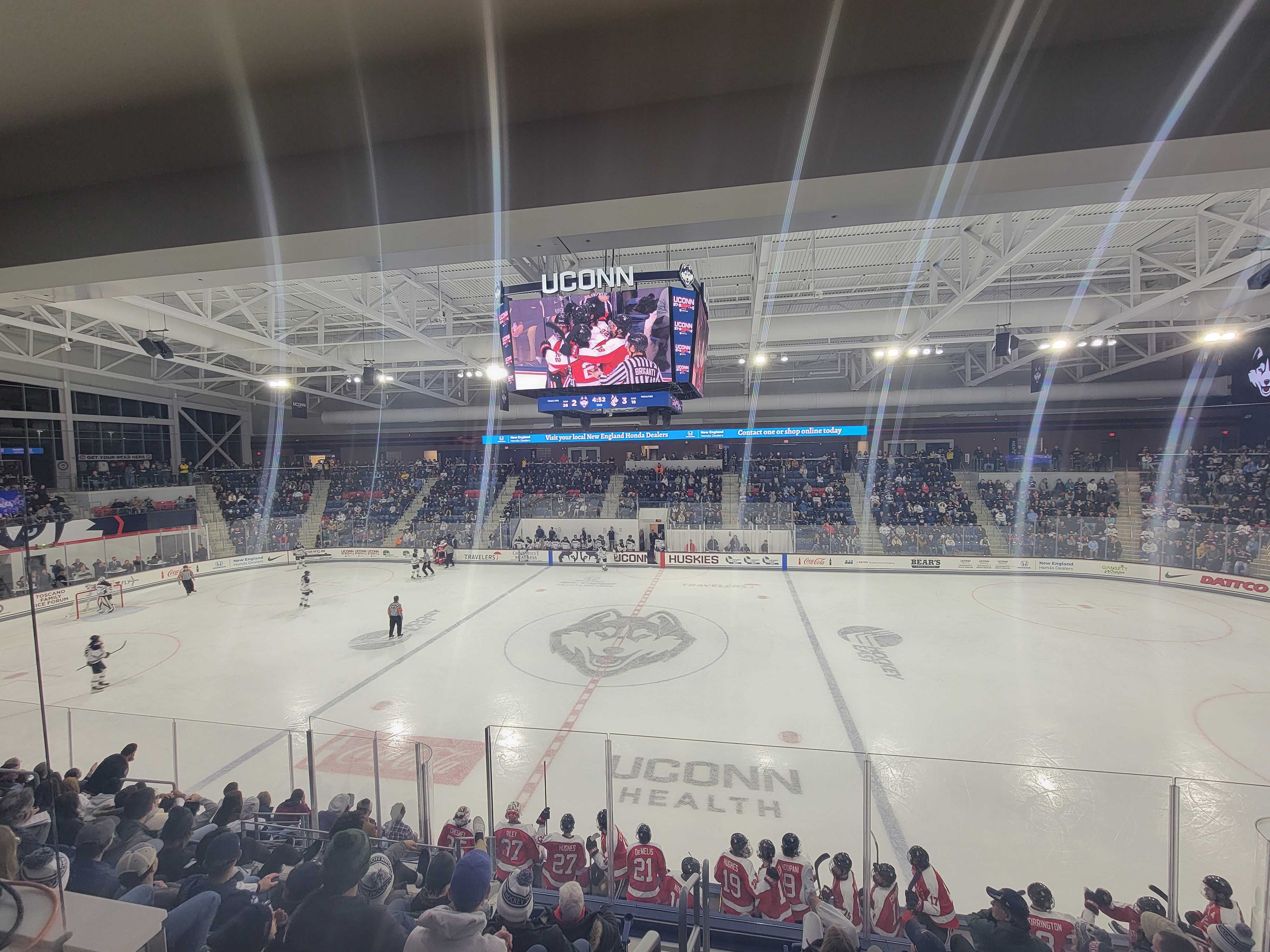 Digital scoreboard displaying video during a hockey game at the Toscano Family Ice Forum