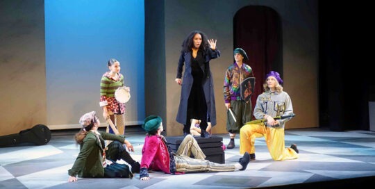 Actors on stage at the NEO Theater