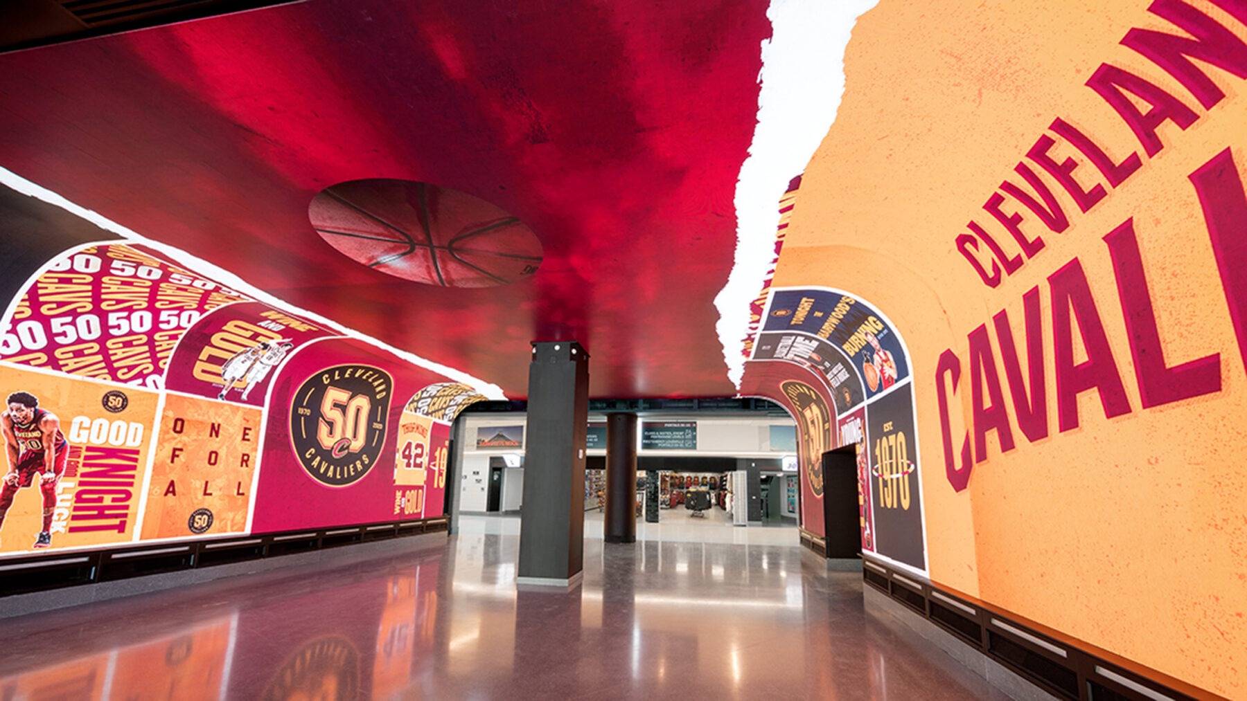 An indoor walkway/tunnel with 360 degree digital displays showing Cleveland Cavalier graphics