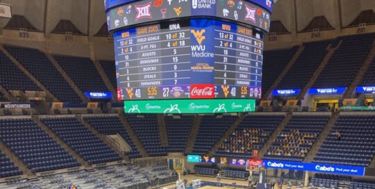 Digital scoreboard in an indoor basketball arena