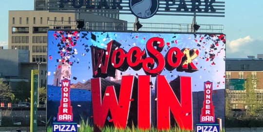 Large digital sign at Polar Park. The sign is showing a graphic that says, "Woo Sox Win"