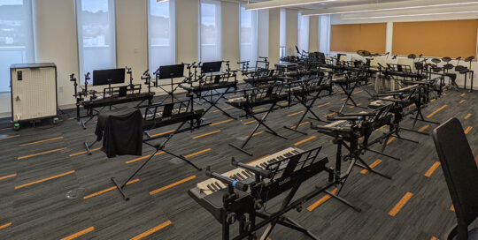 Rows of keyboards in a music classroom